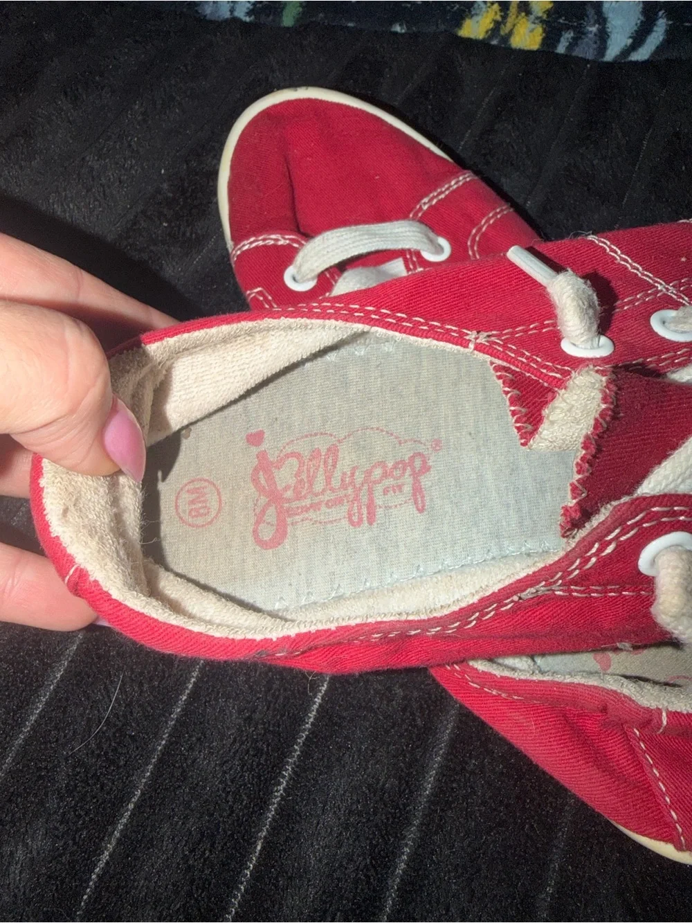 Red canvas sneakers with white stitching size 8